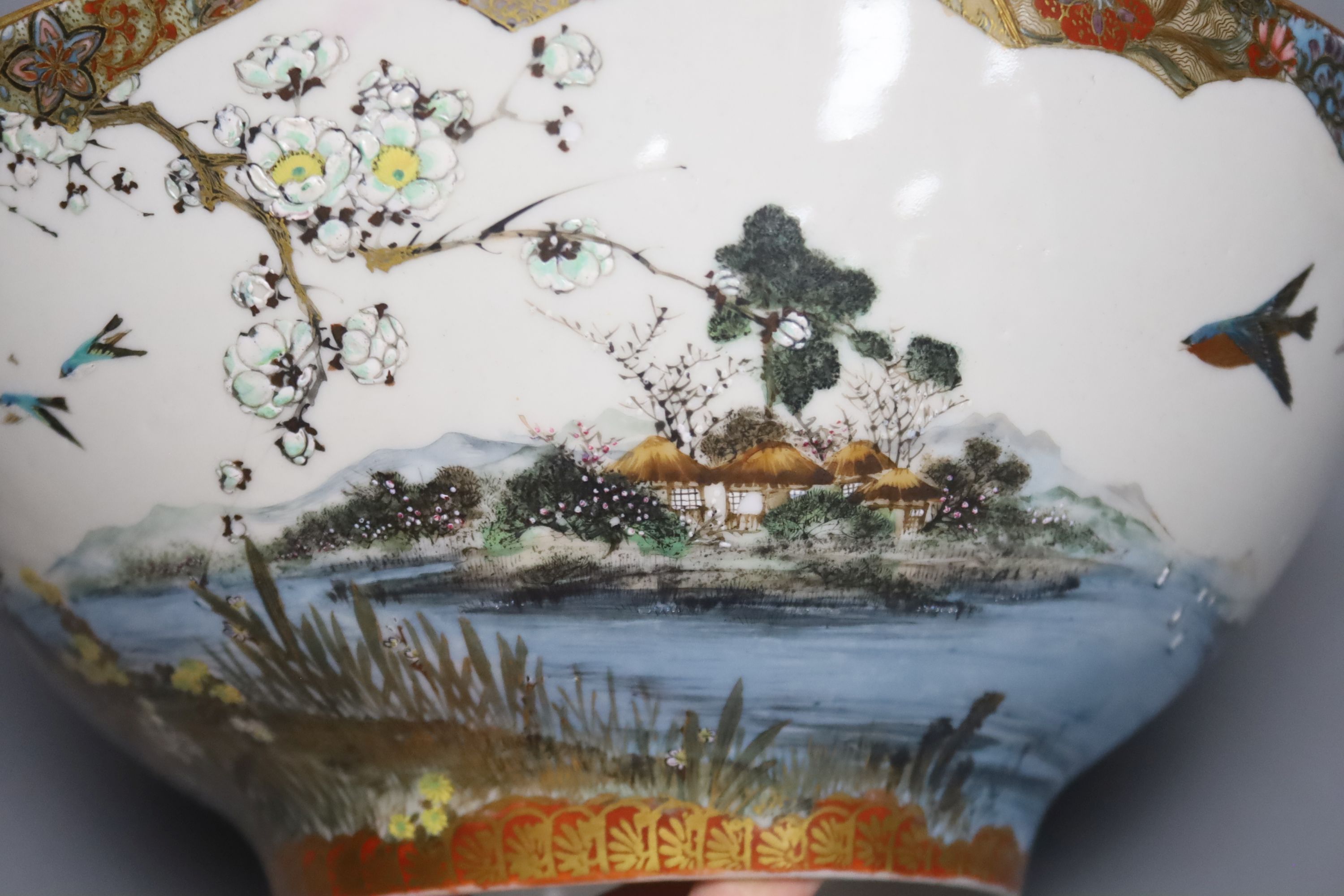 A large early 20th century Japanese Kutani bowl, painted with peacocks and flowers, 13cm high, 31cm diam